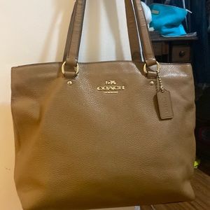 Coach hand bag with leather straps